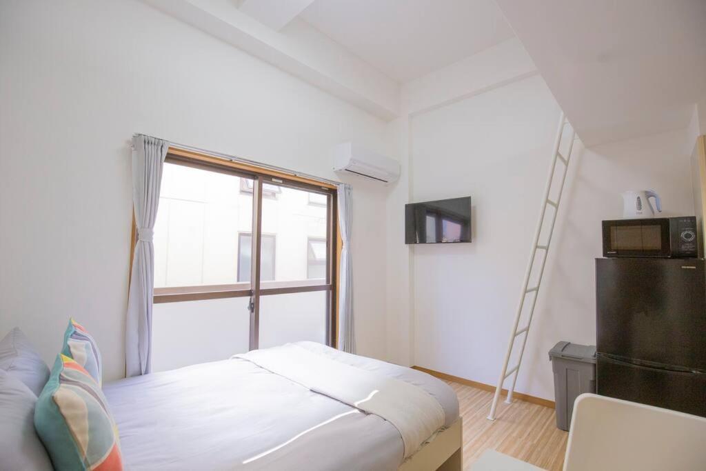 閑静な住宅街_暖かく居心地の良いデザイン Eos-J Токио Экстерьер фото